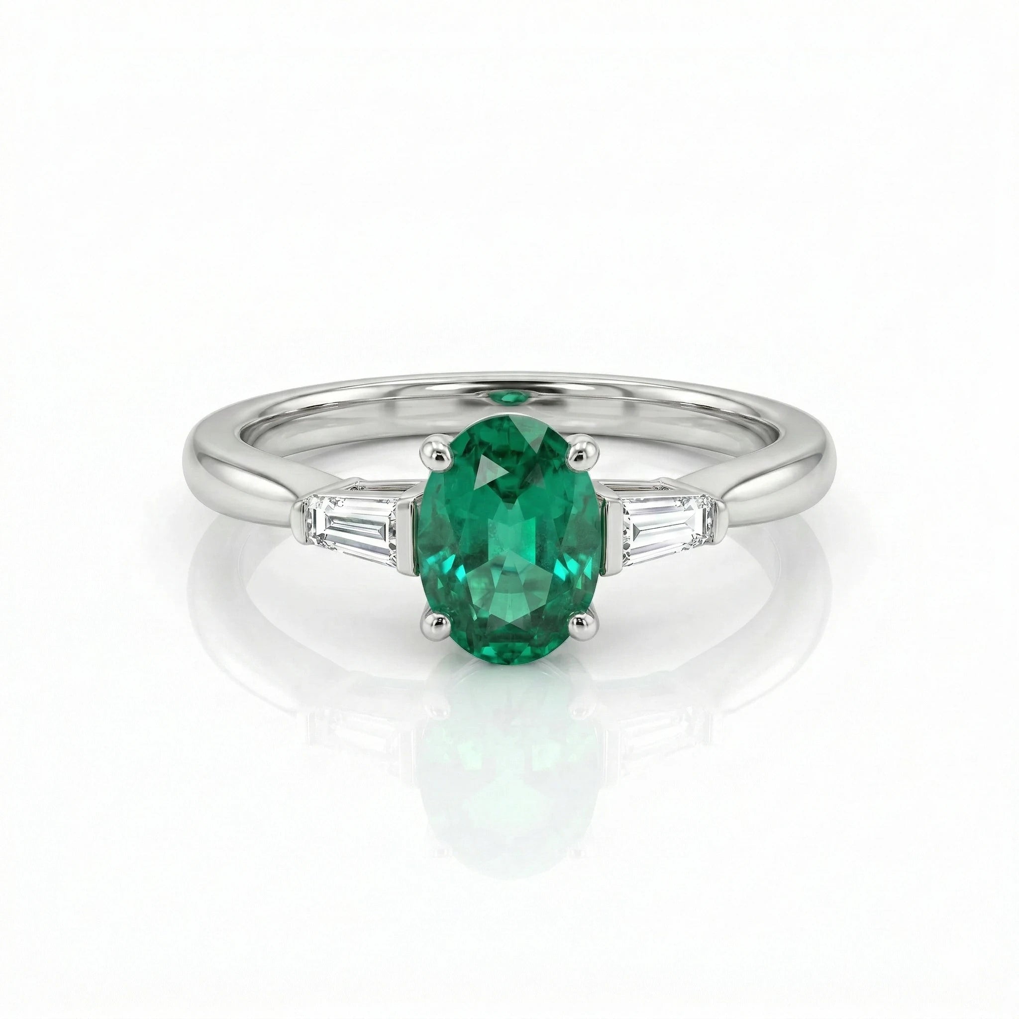0.60ct Oval Cut Emerald Engagement Ring with Two Side Stones Chloe's Jewellers