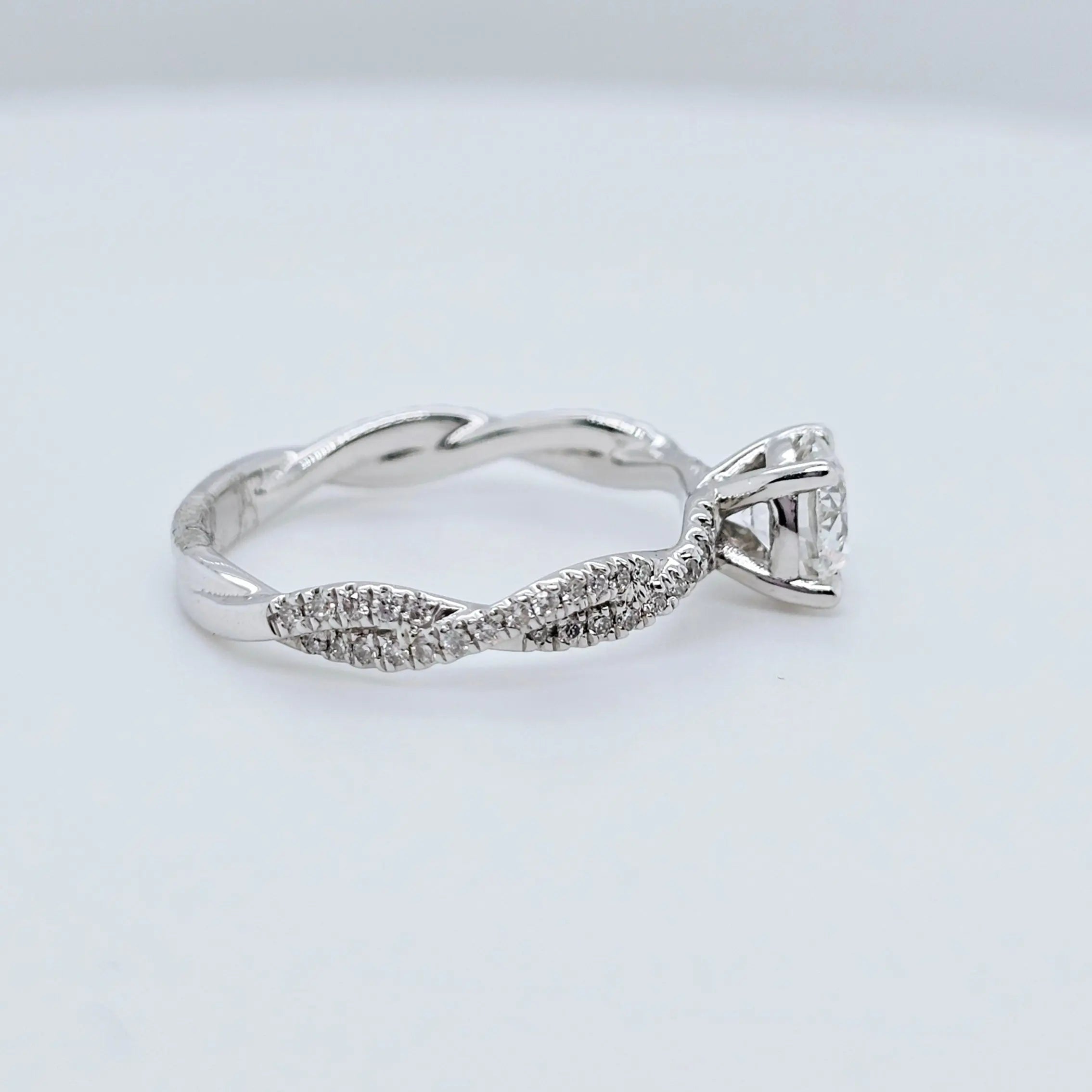 Solitaire engagement ring | Twisted band engagement ring | 18k white gold wedding ring Chloe's Jewellers