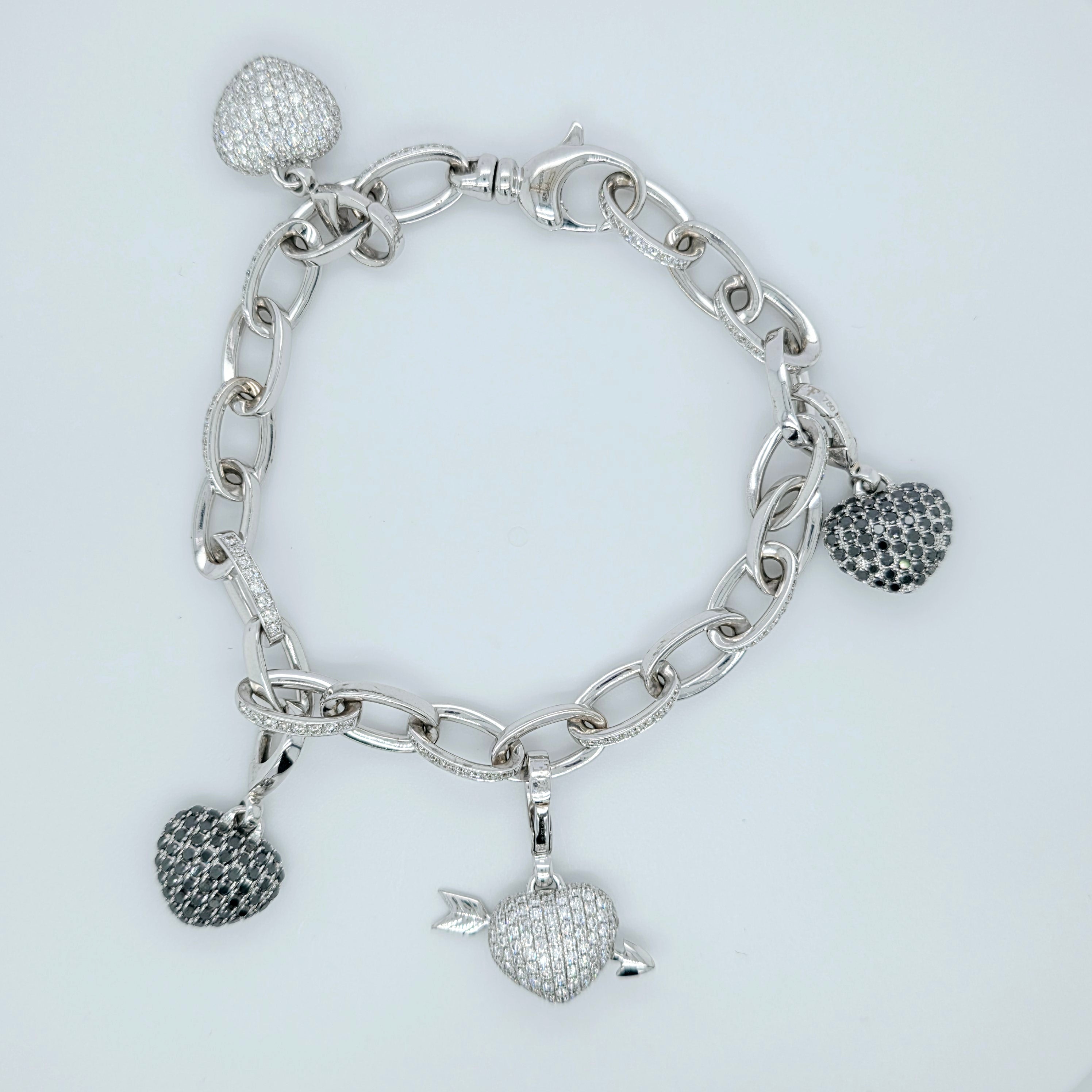 Pre-Owned Theo Fennell Diamond Charm Bracelet | 18K White Gold, 4 Charms Chloe's Jewellers
