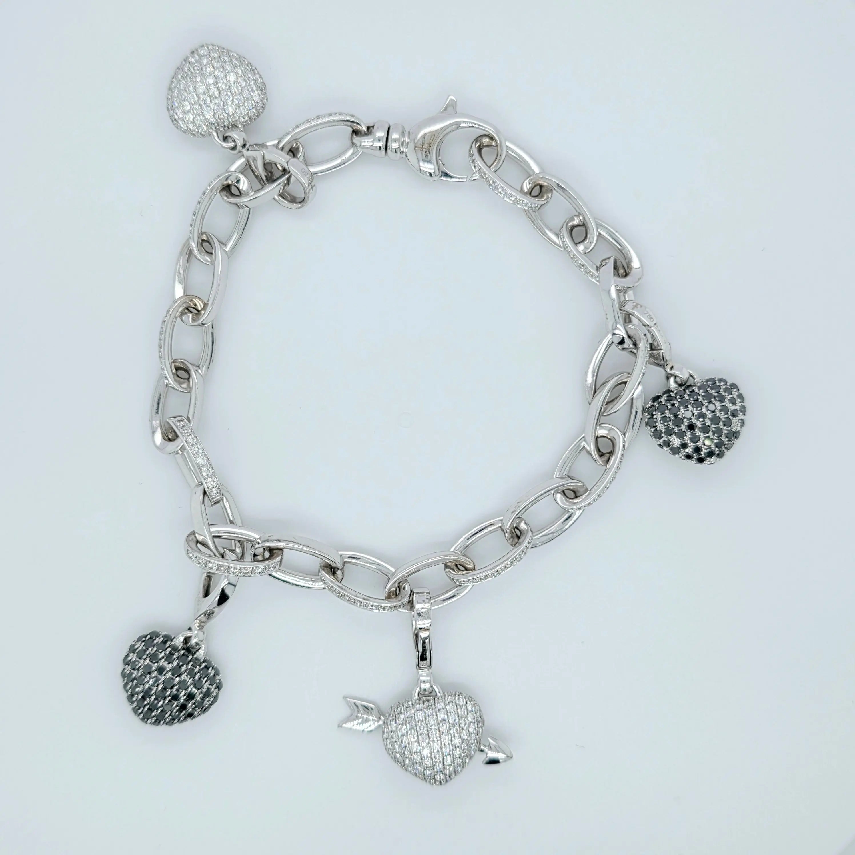 Pre-Owned Theo Fennell Diamond Charm Bracelet | 18K White Gold, 4 Charms Chloe's Jewellers