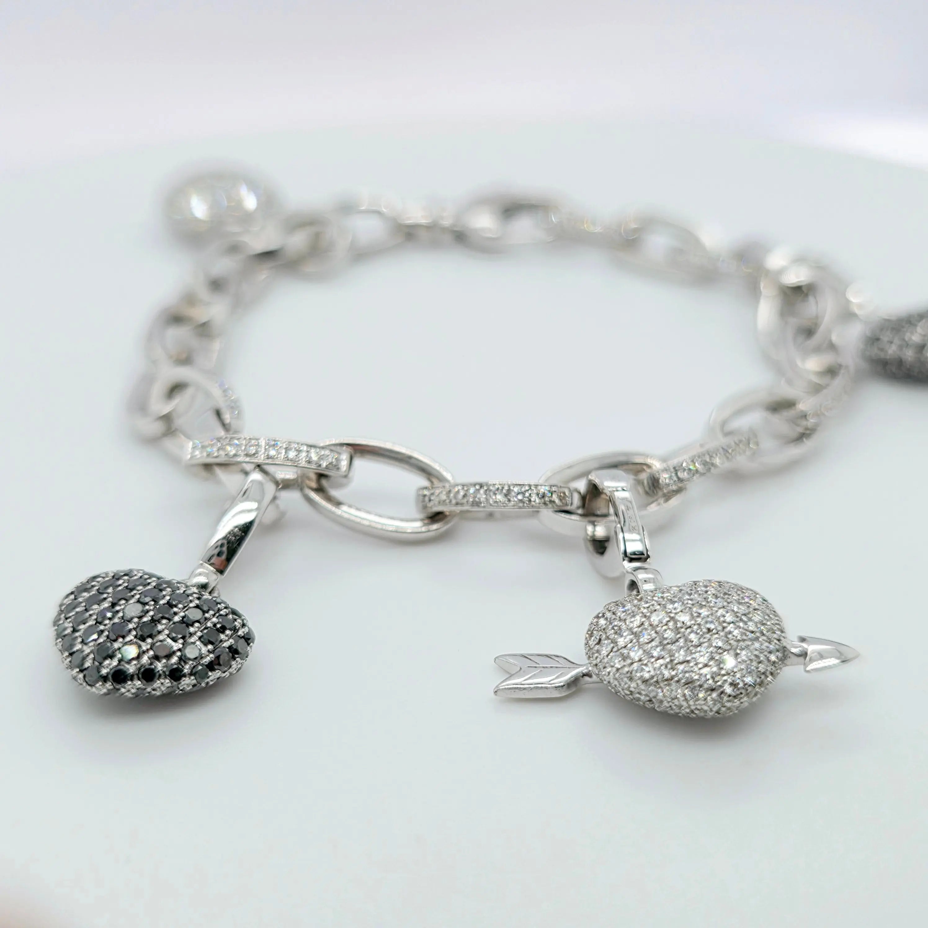 Pre-Owned Theo Fennell Diamond Charm Bracelet | 18K White Gold, 4 Charms Chloe's Jewellers