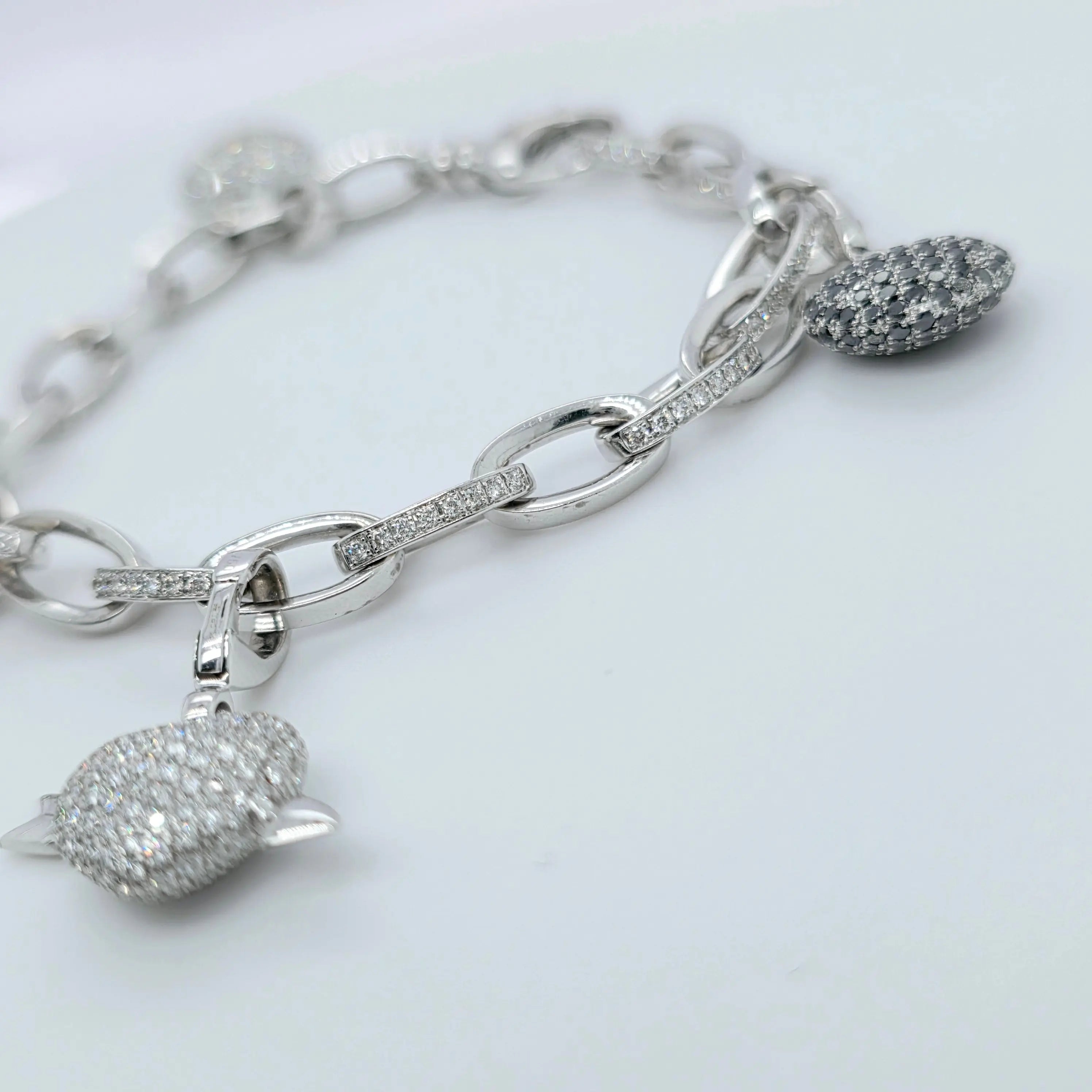 Pre-Owned Theo Fennell Diamond Charm Bracelet | 18K White Gold, 4 Charms Chloe's Jewellers