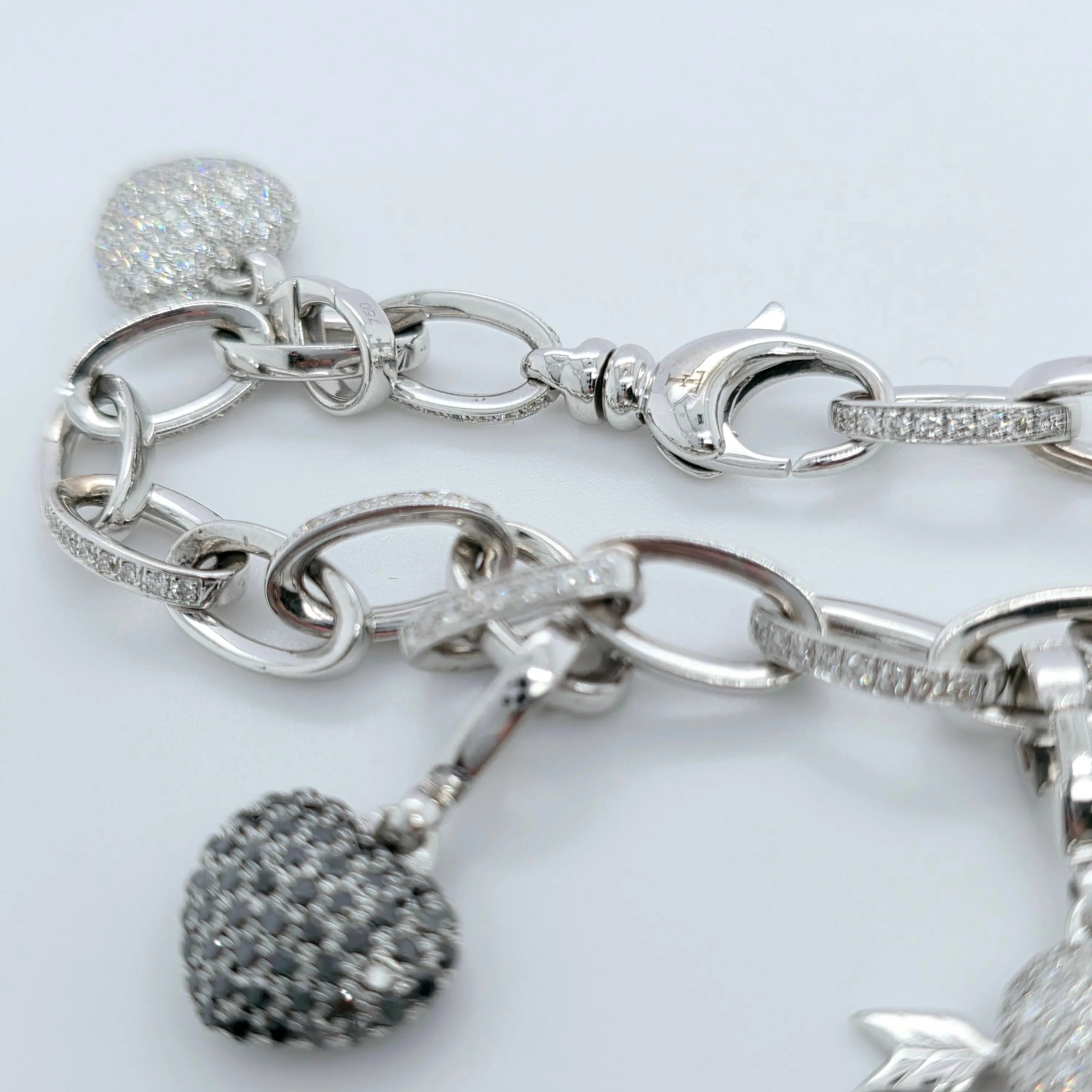 Pre-Owned Theo Fennell Diamond Charm Bracelet | 18K White Gold, 4 Charms Chloe's Jewellers