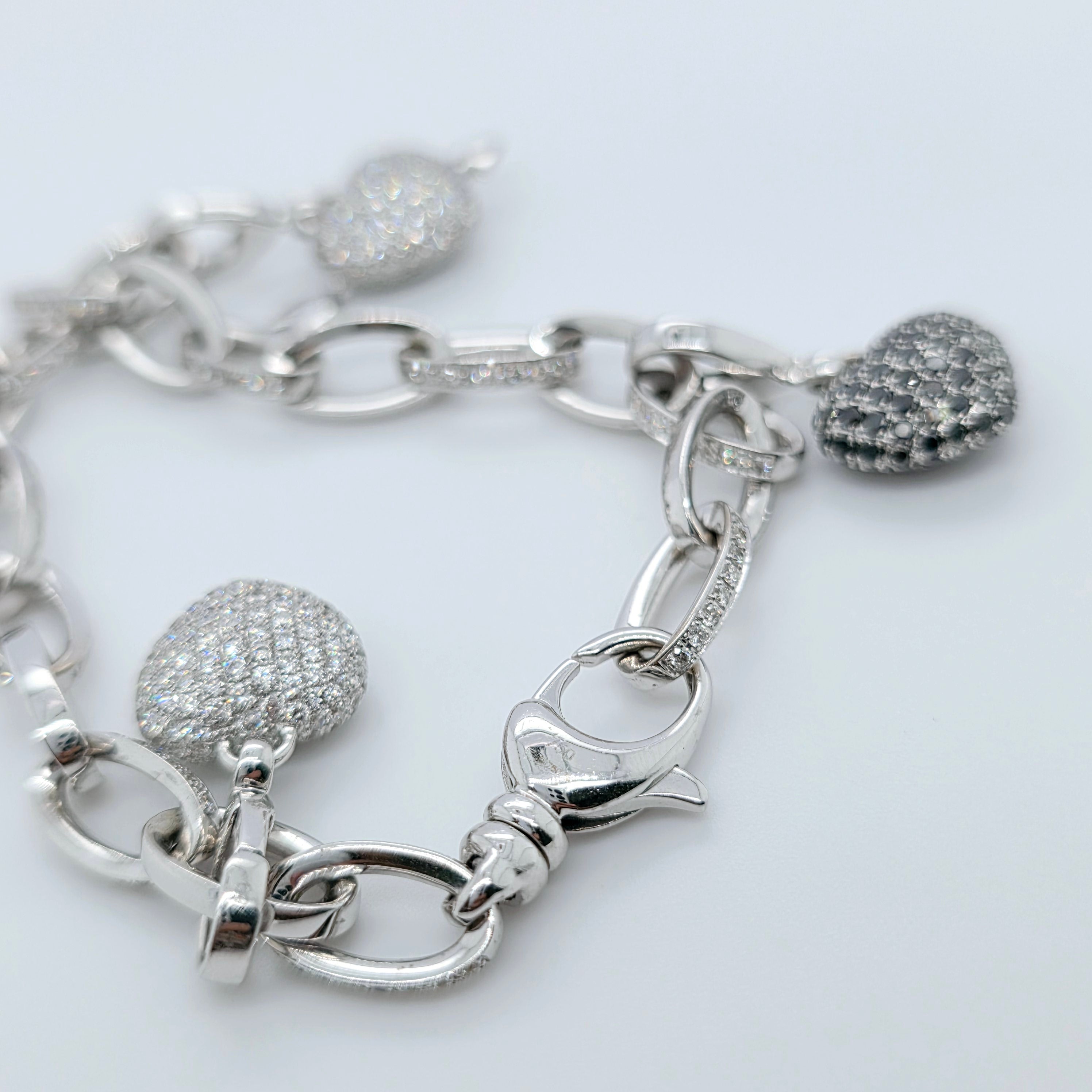 Pre-Owned Theo Fennell Diamond Charm Bracelet | 18K White Gold, 4 Charms Chloe's Jewellers