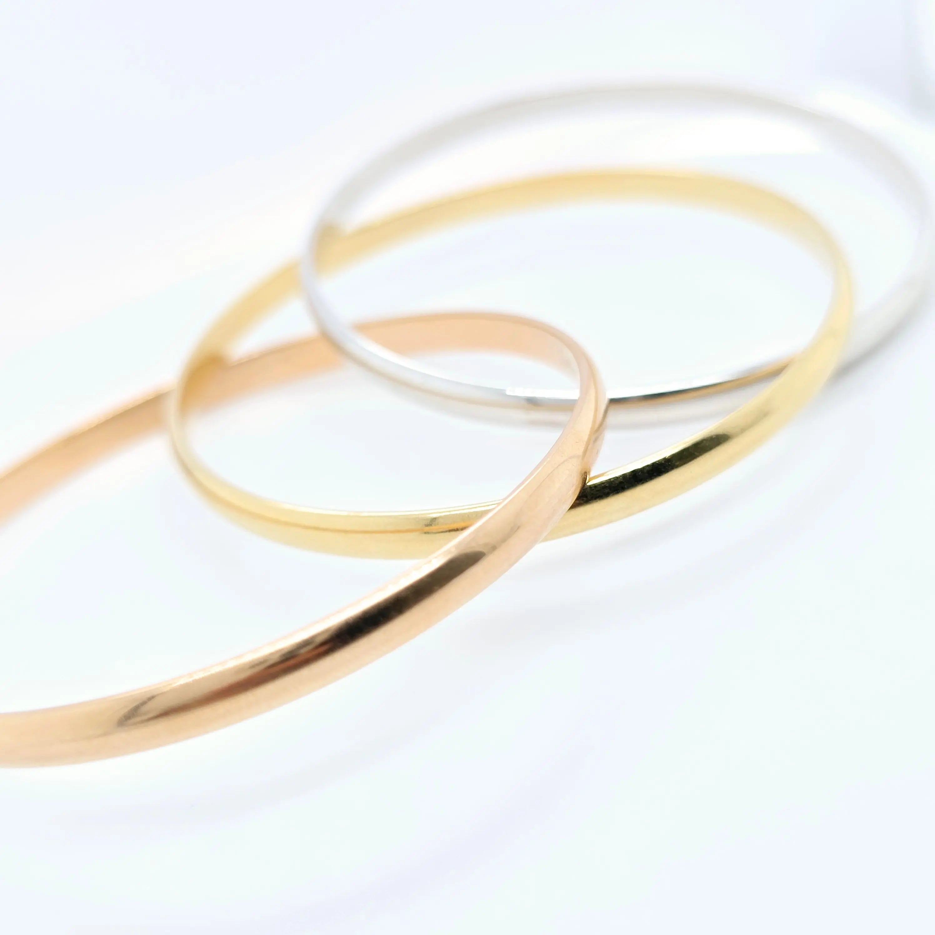 Pre-Owned Cartier Trinity Bangle | 18K Tri-Color Gold, Size 17cm Chloe's Jewellers