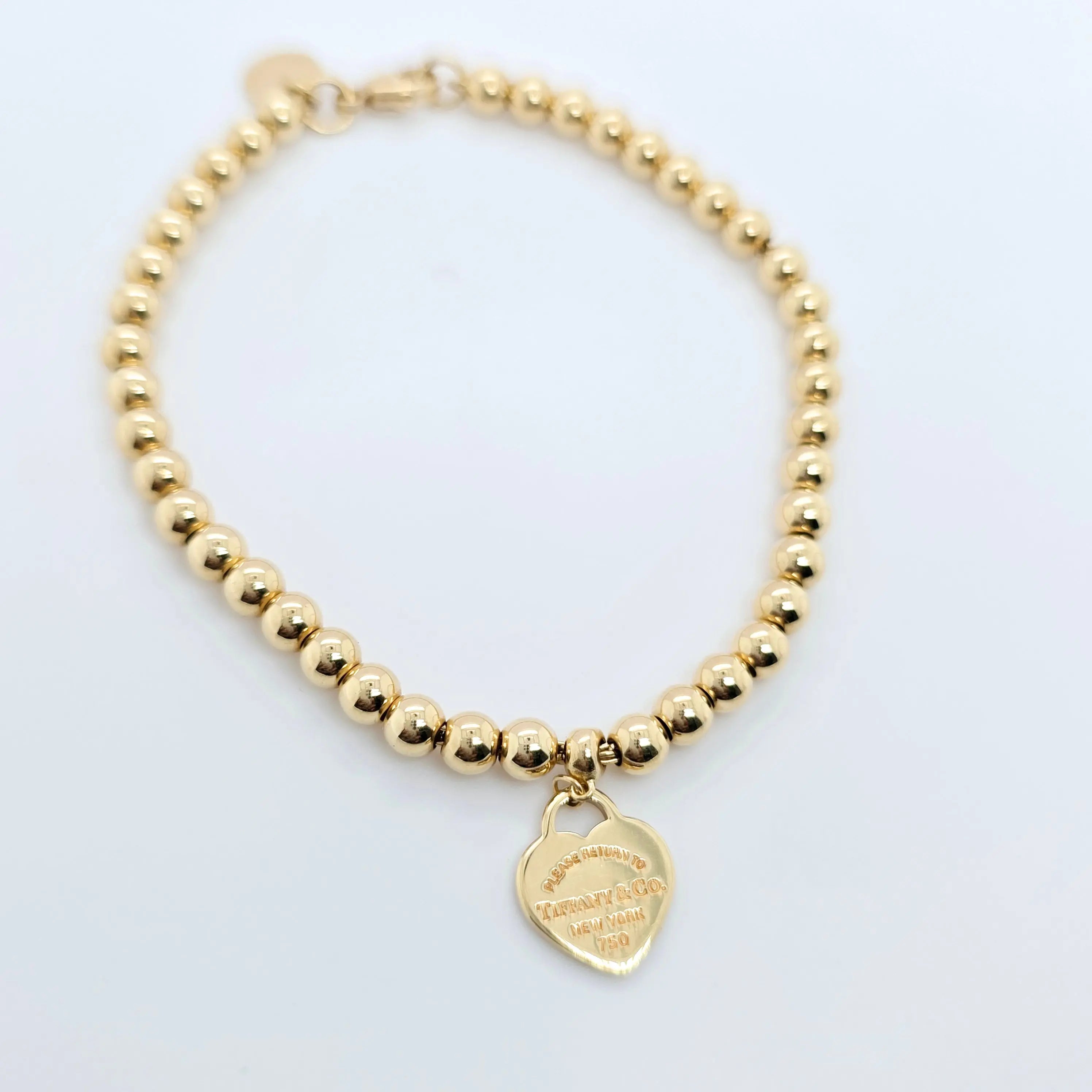 Tiffany & Co. Mini Heart Tag Bead Bracelet | 18K Gold | Red Enamel Chloe's Jewellers