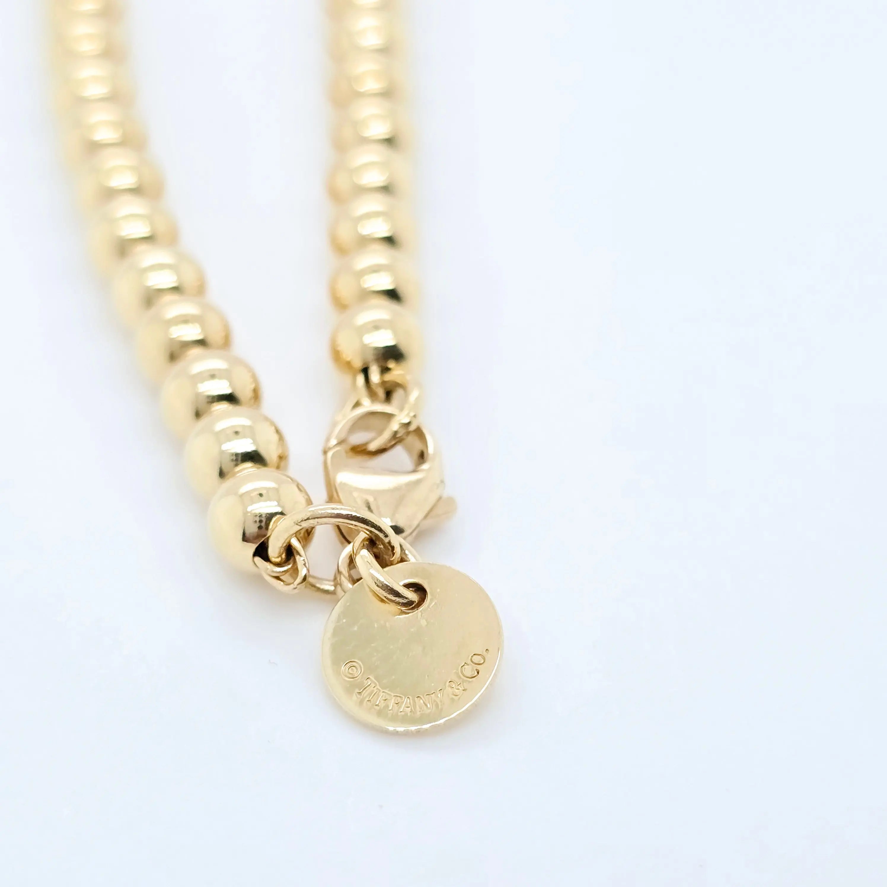 Tiffany & Co. Mini Heart Tag Bead Bracelet | 18K Gold | Red Enamel Chloe's Jewellers